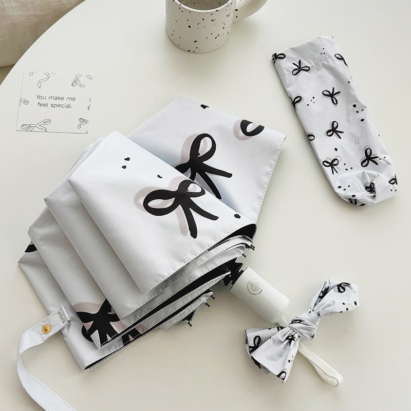 Women’s Folding Umbrella with Playful Bow Pattern Bowlift