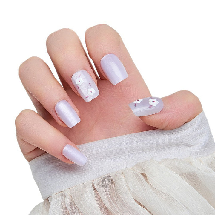Artistic nail extensions with floral accents Bowlift