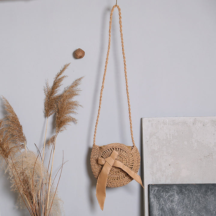 Handwoven shoulder bag with decorative bow accent Bowlift