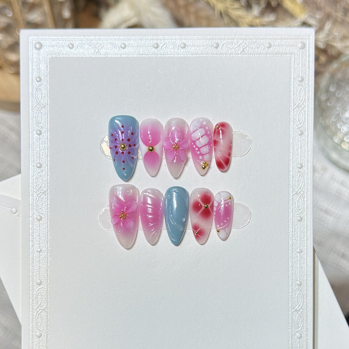 Artistic Press-On Nail Set with Floral and Abstract Designs Bowlift