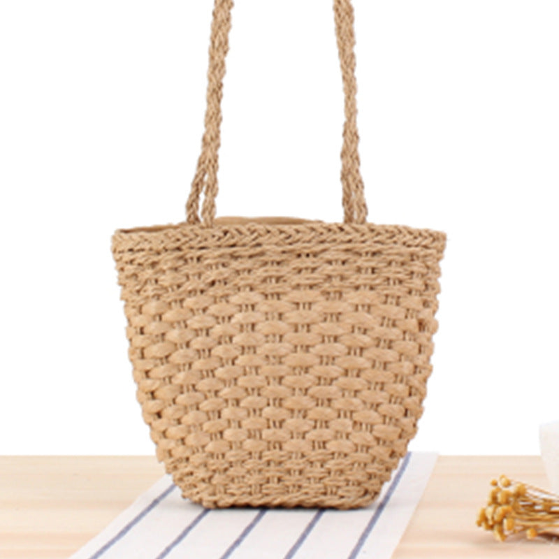 Braided handbag made of natural raffia with robust carrying straps Bowlift
