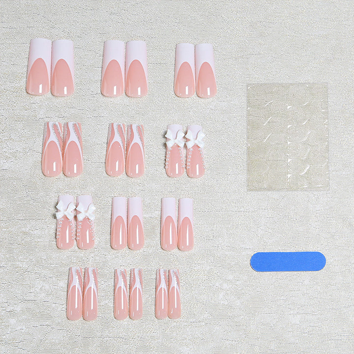 Artificial nail set with elegant bow and pearl decorations Bowlift