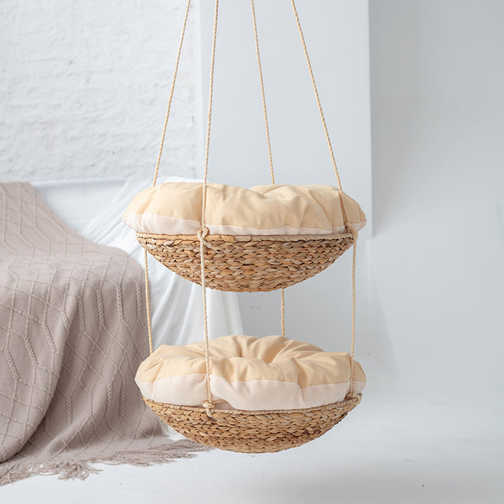 Hanging chair made of braided natural material with comfortable cushions Bowlift