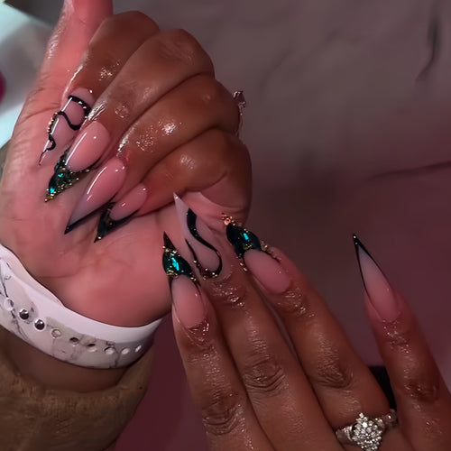 Elegant Stiletto Nail Enhancements with Gem Accents Bowlift