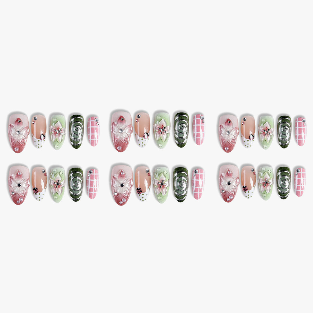 Artificial nail set with floral accents and glitter details Bowlift