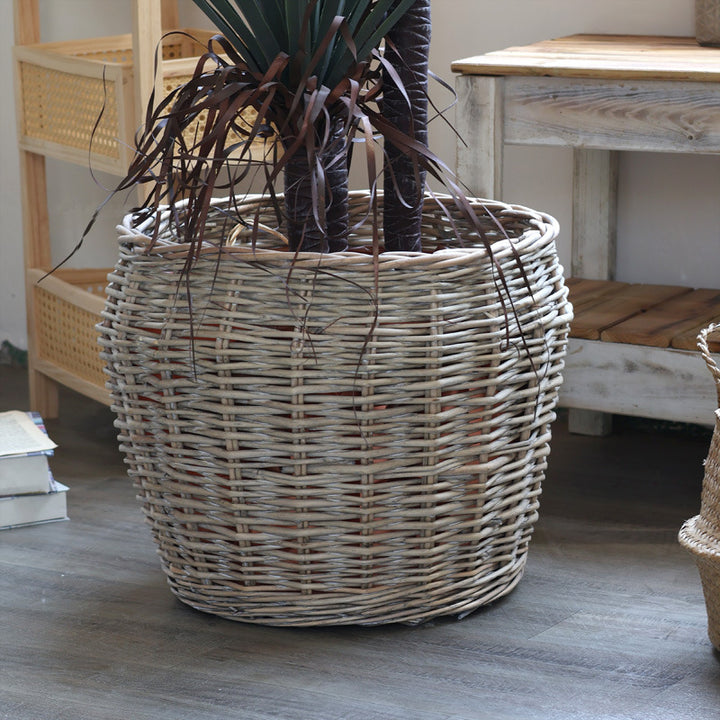 Stylish laundry basket made of braided natural material Bowlift