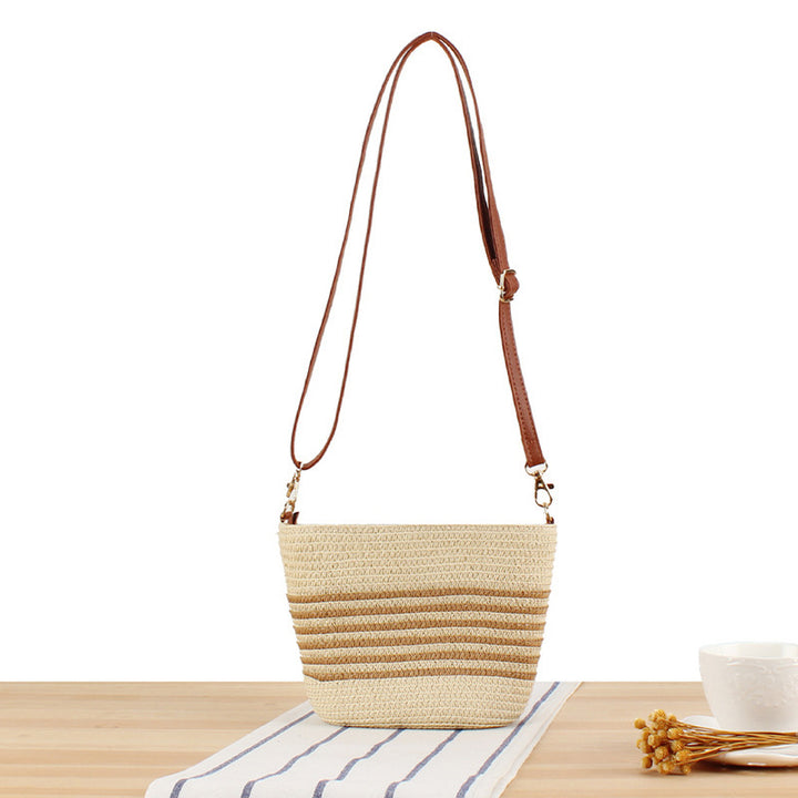 Shoulder bag made of woven natural material with contrasting stripes Bowlift
