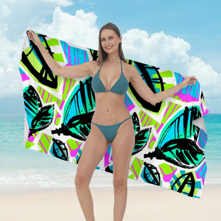 Beach towel with vibrant tropical plant motif Bowlift