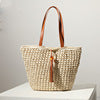 Handcrafted basket bag with fashionable tassel detail Bowlift