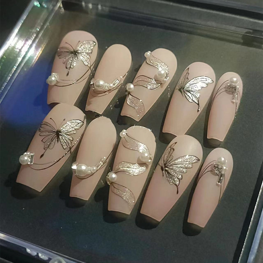 Artificial nails with filigree butterfly design Bowlift