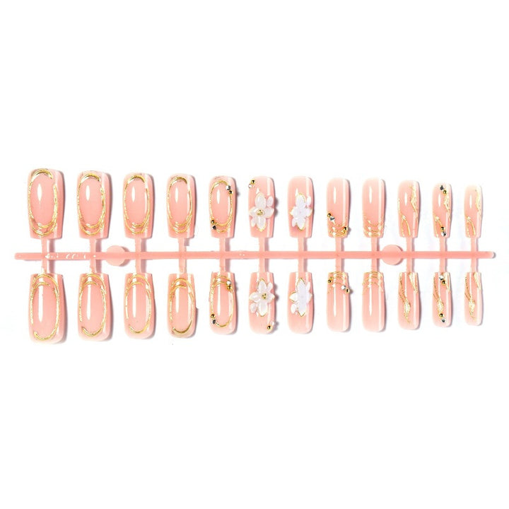 Elegant artificial nail set with decorative flower and gold embellishments Bowlift