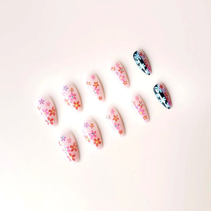 Artificial nail set with floral 3D embellishments and glitter accents Bowlift