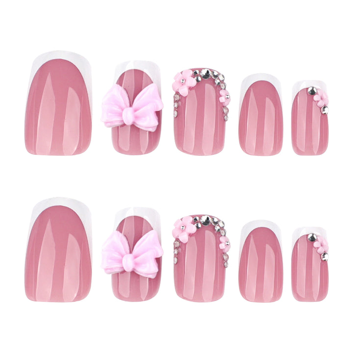 Artful nail extensions with sparkling accents and bow decorations Bowlift