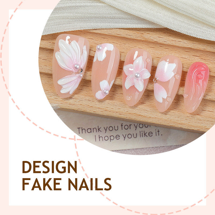 Artificial nail set with floral motifs and rhinestone decorations Bowlift