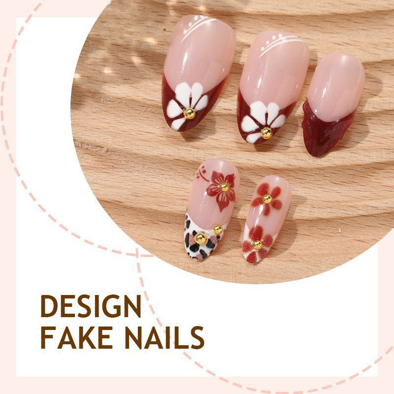Elegant artificial nails with floral accents and glitter Bowlift
