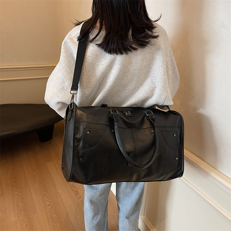 Elegant leather bag with stylish design and versatile carrying options Bowlift