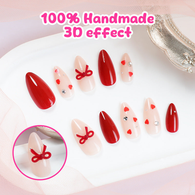 Artificial nail set with festive heart and bow accents Bowlift