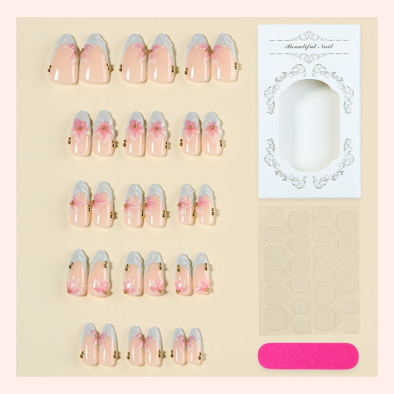 Creative nail art set with delicate flower design and glitter accents Bowlift
