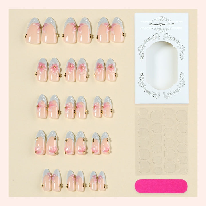Creative nail art set with delicate flower design and glitter accents Bowlift