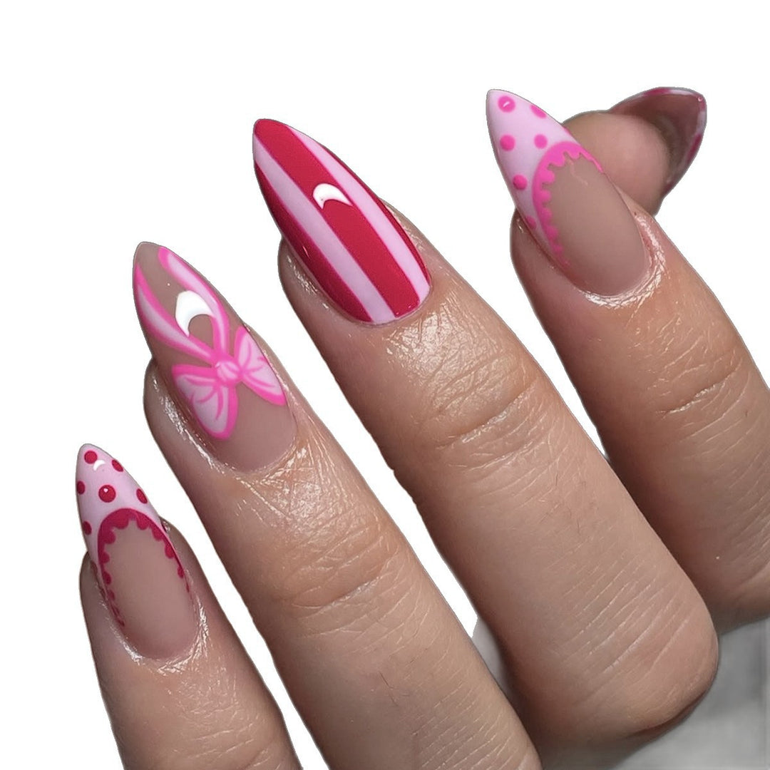 Nail set with playful bow and stripe pattern Bowlift