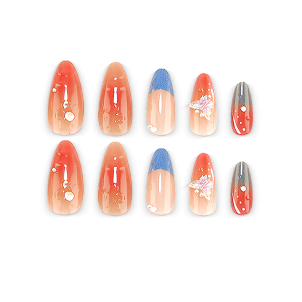 Artful nail art with pearls and butterfly details Bowlift