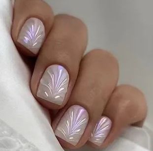 Acrylic nail set with elegant pearl details and fine floral patterns Bowlift