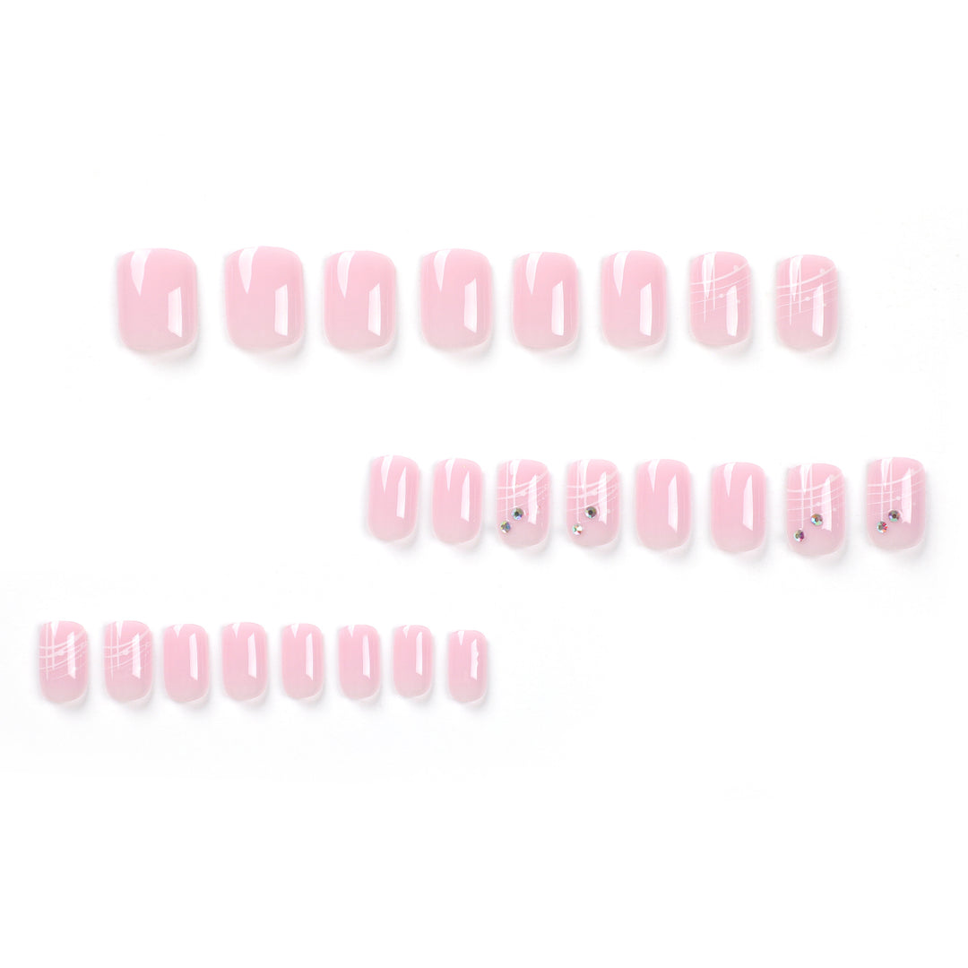 Artful nail extensions with elegant design and rhinestone embellishments Bowlift