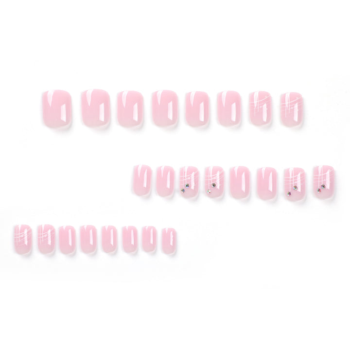 Artful nail extensions with elegant design and rhinestone embellishments Bowlift