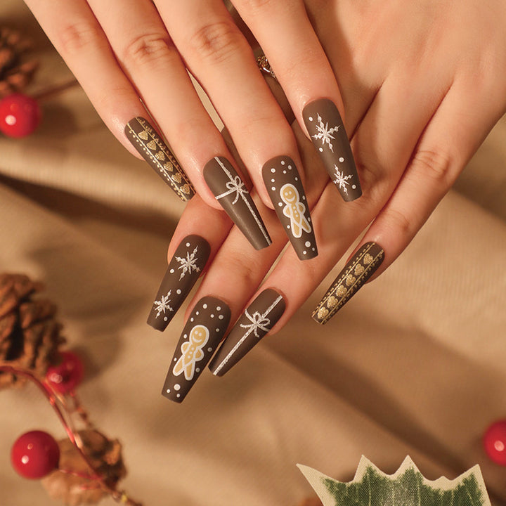 Artful Christmas nail art with original gingerbread motif Bowlift