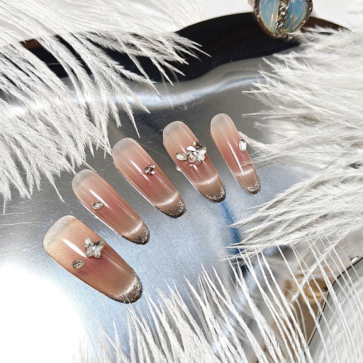 Glamorous artificial nails with glitter decorations Bowlift
