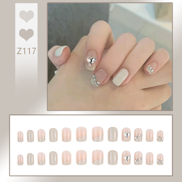 Glamorous artificial nails with heart and rhinestone decorations Bowlift