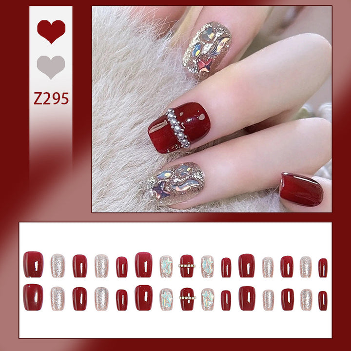 Glamorous artificial nail set with sparkling 3D applications and elegant embellishments Bowlift