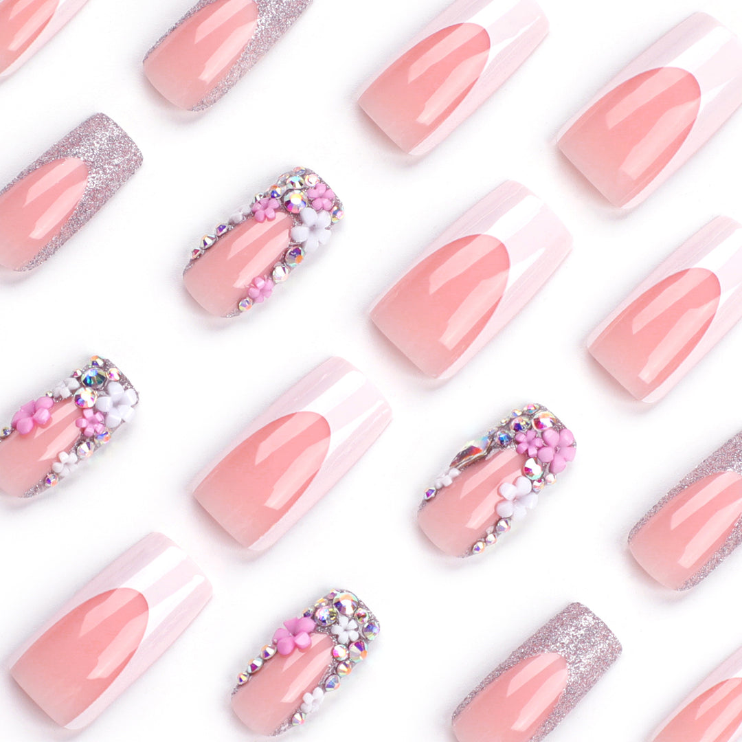 Artificial nails with floral decorations and glitter effects Bowlift