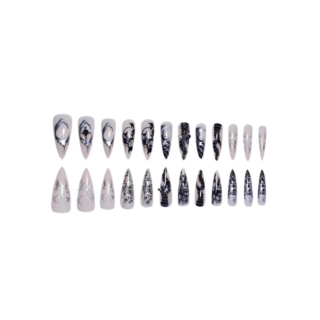 Artistic Stiletto Nail Enhancements with Intricate Patterns Bowlift