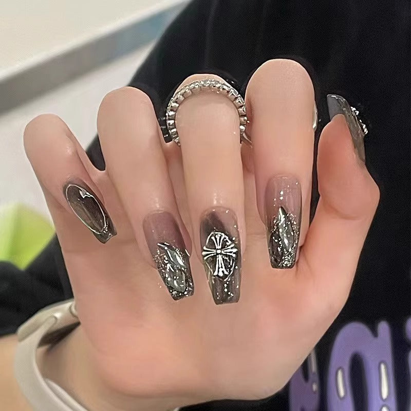 Glamorous artificial nails with heart design and glittering accents Bowlift