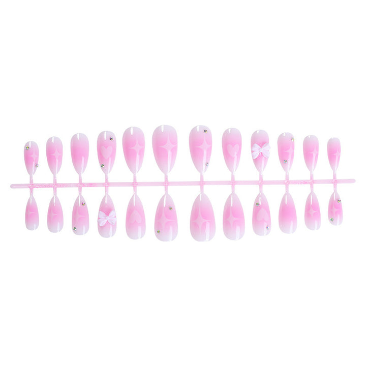 Acrylic nail set with delicate heart-shaped accents Bowlift