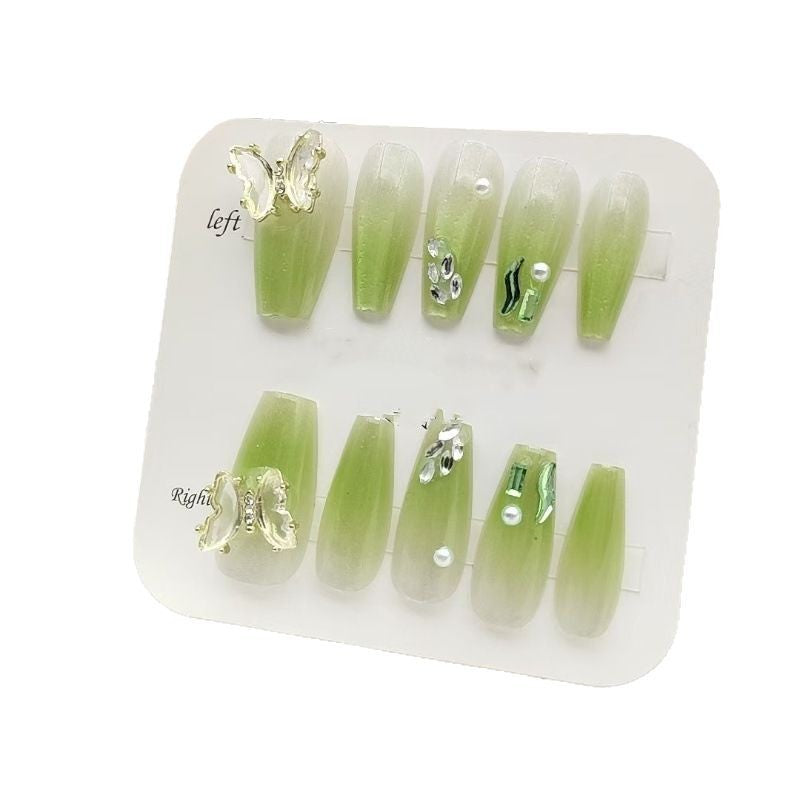 Artificial nails with butterfly accents and glitter details Bowlift