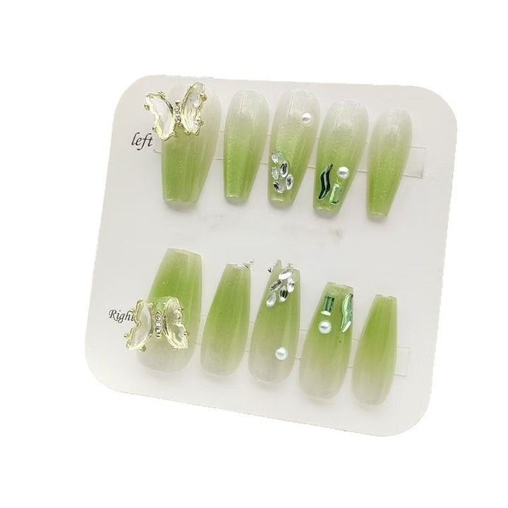 Artificial nails with butterfly accents and glitter details Bowlift