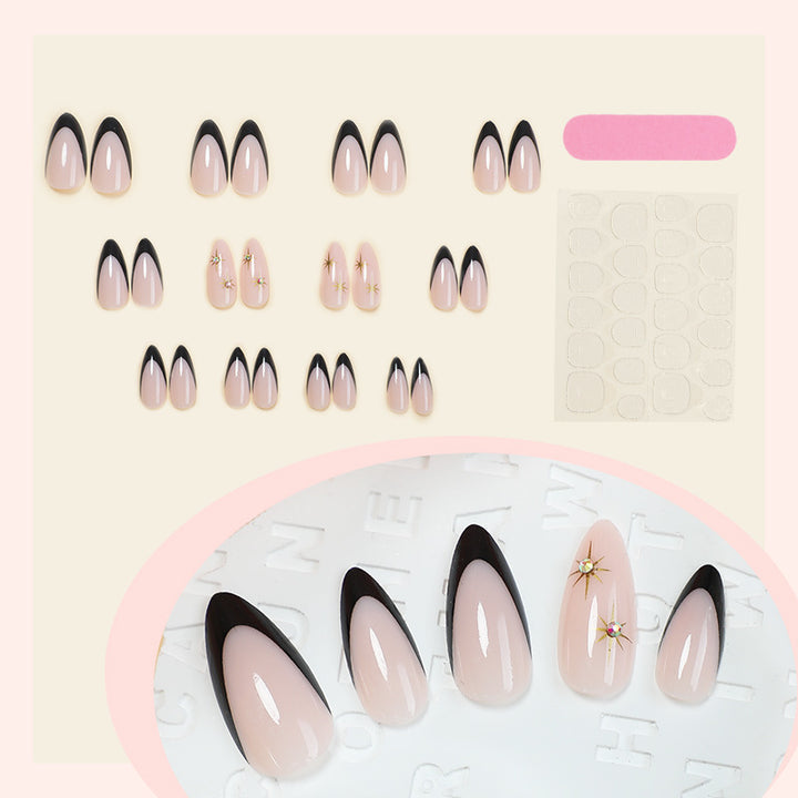 Artificial nail set with elegant black-and-white design and golden star accents Bowlift