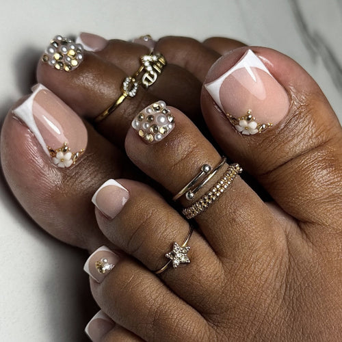 Glamorous toenail art with luxurious rhinestone and floral designs Bowlift