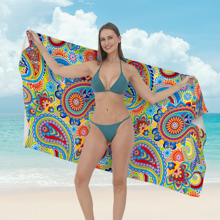Beach towel with vibrant tropical plant motif Bowlift
