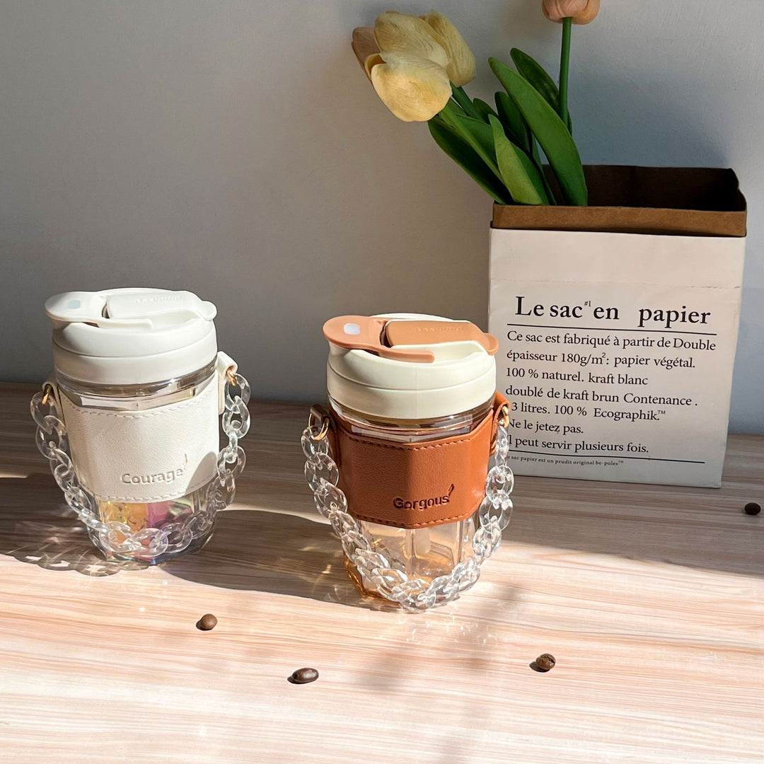 Women drinking cup with elegant leather handle and practical carrying chain Bowlift