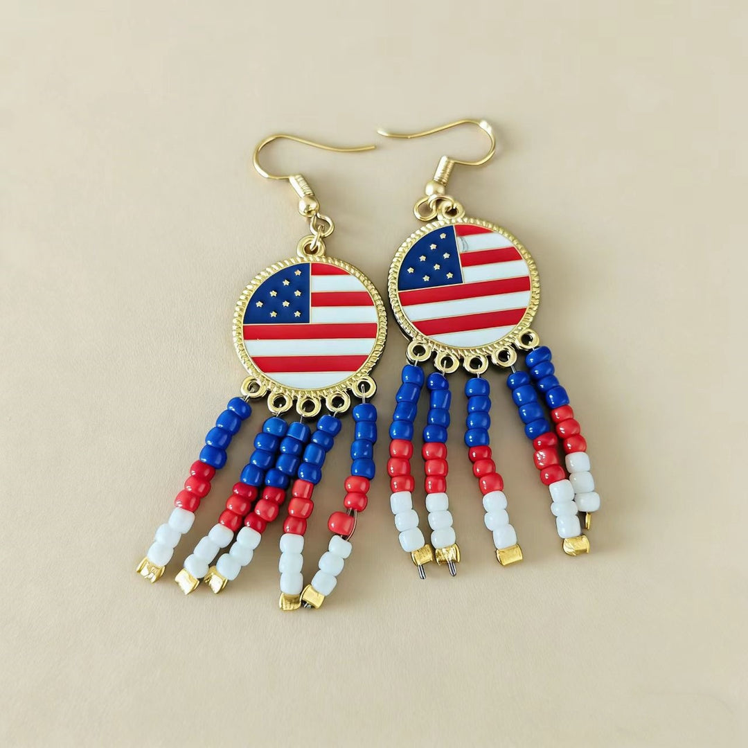 Women's handcrafted tassel earrings with flag medallion and pearl fringes Bowlift