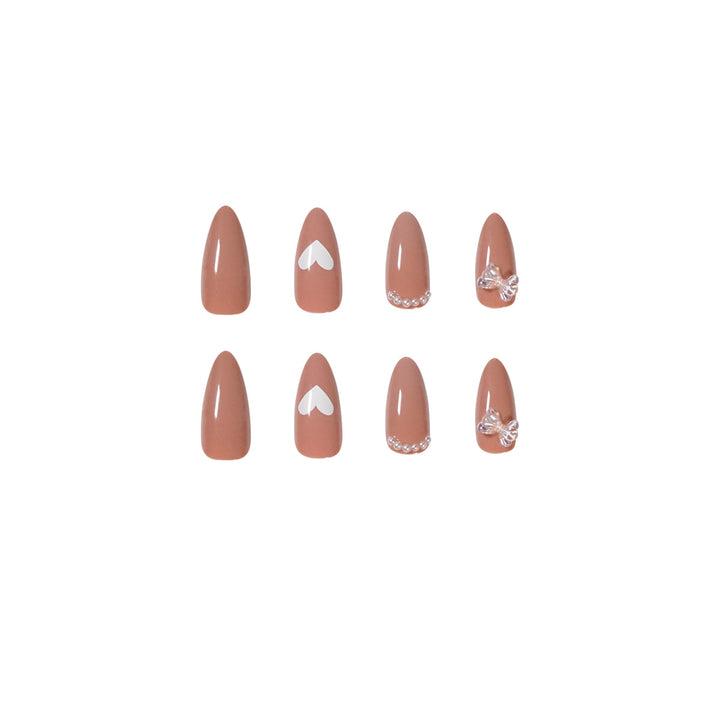 Elegant artificial nails with heart-shaped and glitter accents Bowlift