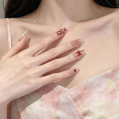 Romantic Themed Press-On Nail Set with Heart and Bow Accents Bowlift
