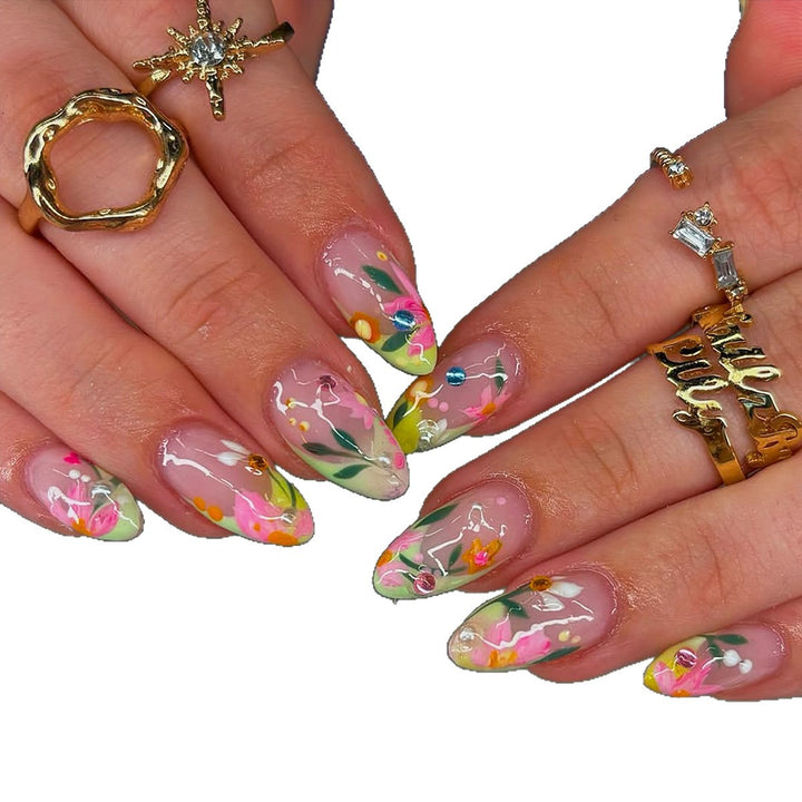 Artificial nails with flower design and glitter accents Bowlift