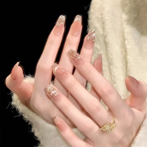 Artificial nail set with sparkling glitter and 3D applications Bowlift