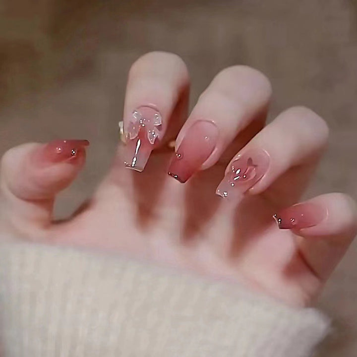 Elegant Long Press-On Nails with Floral Accents Bowlift