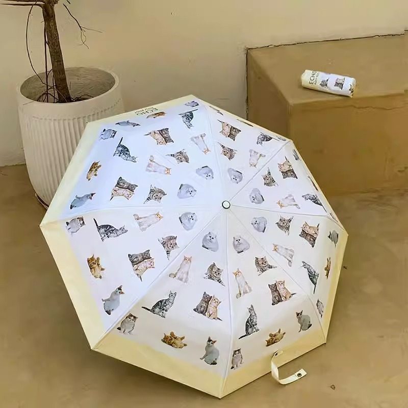 Ladies folding umbrella with playful animal design Bowlift