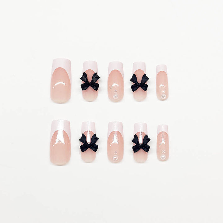 Acrylic nail set with stylish black and pearl details Bowlift